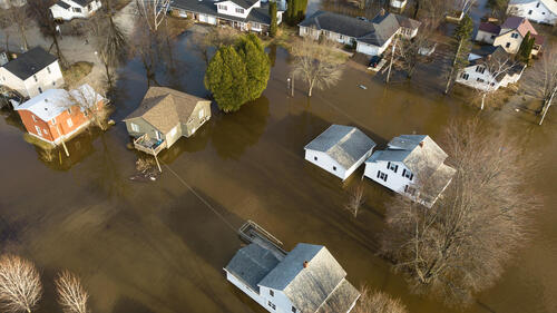 An aerial view of a flooded residential neighbourhood.