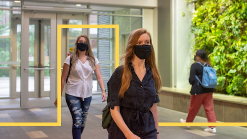 Masked students walk in Environment 3.