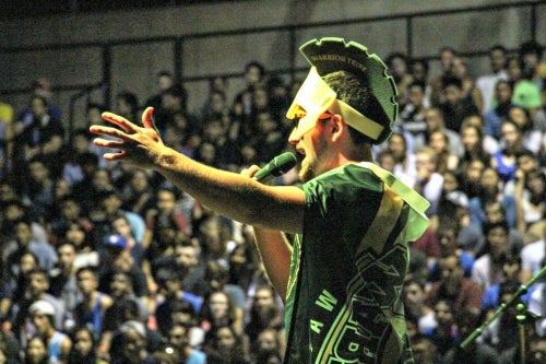A Warrior Tribe member hypes up the crowd in the PAC.