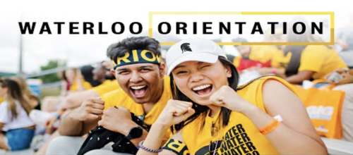 Two students in Waterloo clothing cheer at a sporting event.