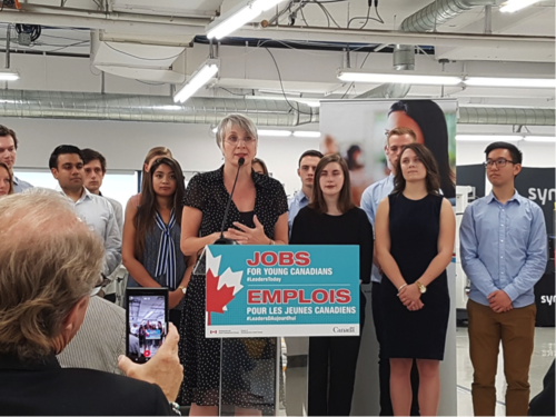Surrounded by co-op students, the Honourable Patty Hajdu, Minister of Employment, Workforce Development and Labour makes funding announcement at Synaptive Medical during an event hosted by BioTalent Canada.