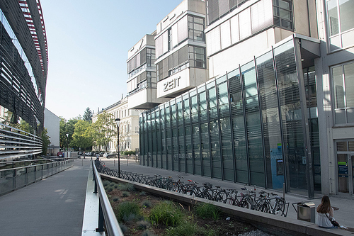 The University of Graz campus with bike racks in the foreground.