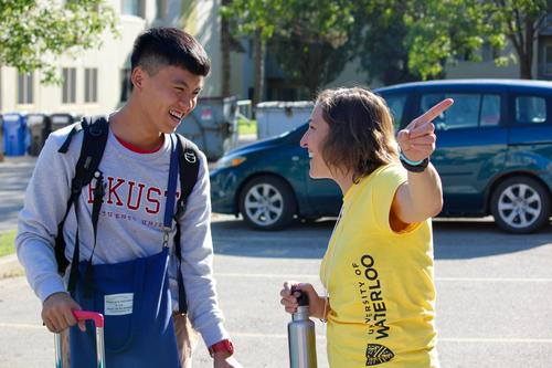 A student success office staff member gives directions to a new Waterloo student.