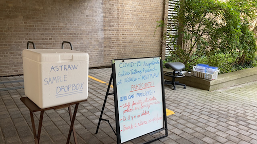 An ASTRAW study drop box and a-frame board announcement on campus.