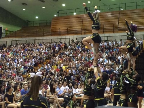 Cheerleaders perform to a packed house at the Warrior Welcome event.