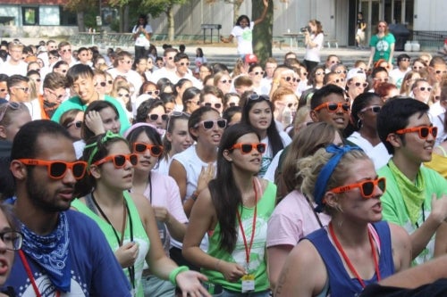 A crowd of first-year students with Orientation sunglasses.