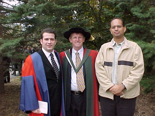 Alfred Menezes (right) and Michele Mosca (left) were inspired by Scott (middle) while still in high school and chose to study mathematics at Waterloo after meeting him. The two alumni who became professors at Waterloo also focused on cryptography.