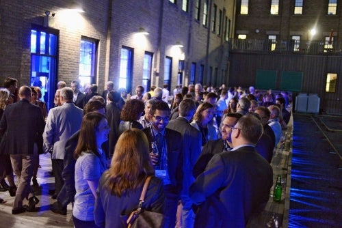 Waterloo Innovation Summit attendees mix and mingle at the opening reception at the Communitech Hub.