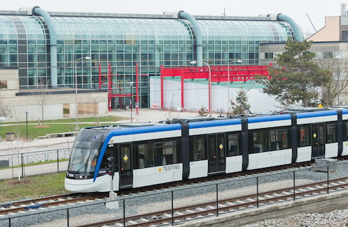 An ION Light Rail vehicle in front of the Davis Centre.