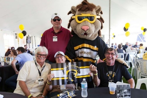 The University of Waterloo's mascot with some Reunion attendees.