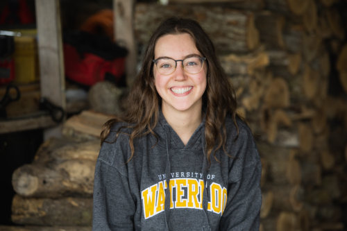 Hanna MacDonald smiles in a Waterloo hoodie.