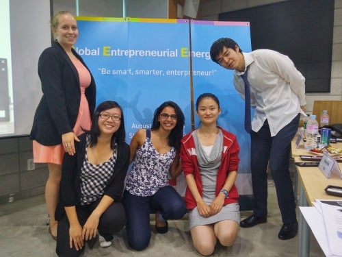 Waterloo students pose in front of the Entrepreneurial Camp sign.