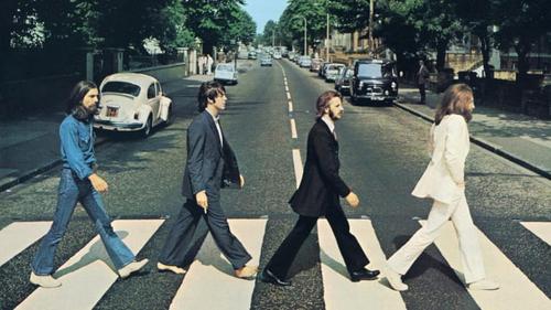 The iconic Abbey Road album cover featuring the Beatles crossing the street.