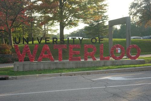 The University of Waterloo sign wrapped in red for United Way kickoff.