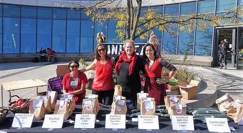United Way volunteers sell baked goods in the Student Life Centre courtyard.
