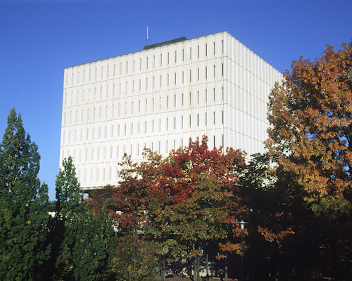 The Dana Porter Library surrounded by trees in fall colours.