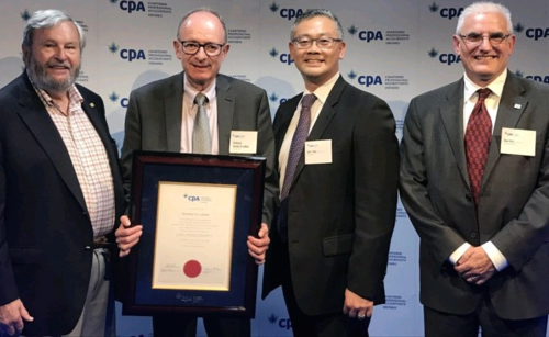 Professor Emeritus Stan Laiken receives his honorary CPA award with CPA Ontario representatives.