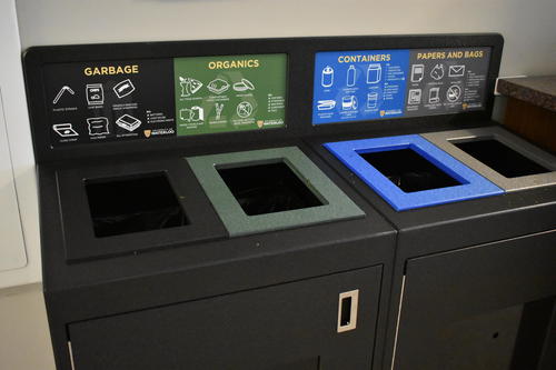 The colour-coded recycling and waste bins.
