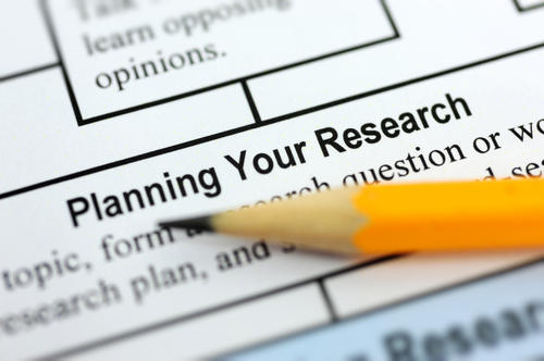 A pencil on a page with the headline &quot;Planning Your Research.&quot;