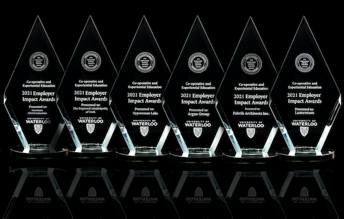 A row of diamond-shaped Employer Impact Awards.