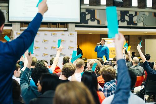 Students vote during the AGM in the Student Life Centre Great Hall.