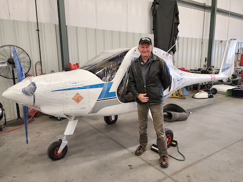 Dr. Paul Parker stands next to the Pipestrel Electro e-plane.