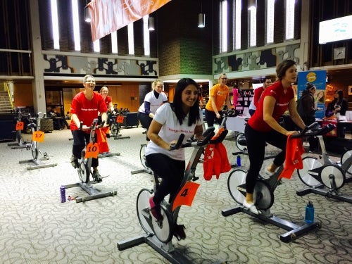 Volunteers ride spin cycles in the Student Life Centre.