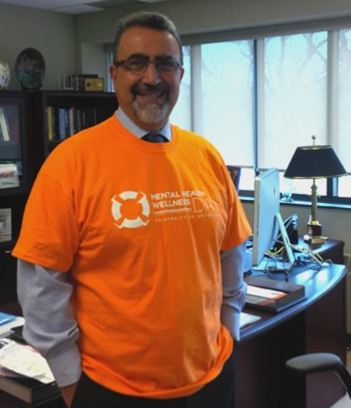 Feridun Hamdullahpur wears an orange shirt for Mental Health Wellness Day in October 2016.