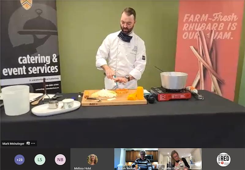 Chef Mark Meinzinger demonstrates cooking while on a Zoom call.