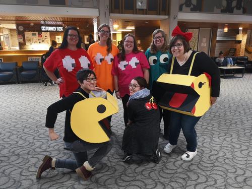 Library staff dressed as Pac Man video game characters.
