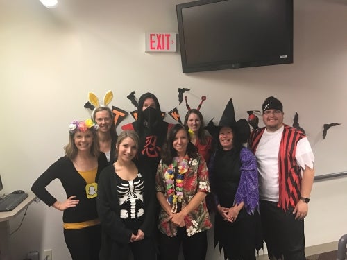 Housing and Residences staff dressed in costumes for Halloween.