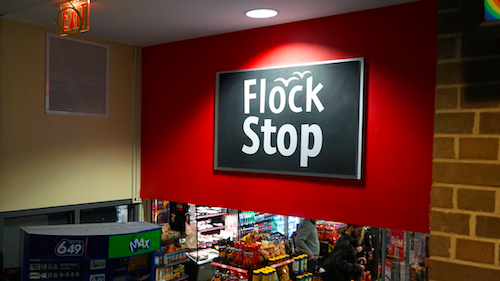The Flock Stop sign over the convenience store in the SLC.