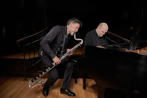 Two members of Blackwood, one playing a bass clarinet and the other playing piano.