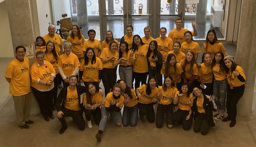 Members of the School of Optometry and Vision Science wear their Thrive Week t-shirts.