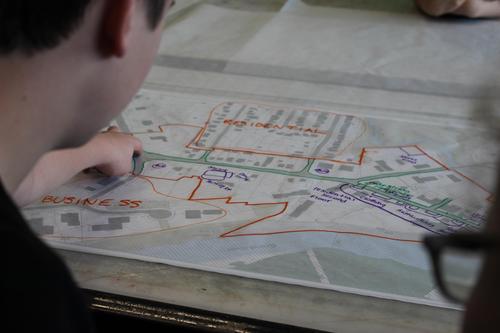 A planner reviews a map showing different zones.