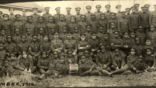 A 1916 photo of a military unit featuring Black enlisted men and white officers.