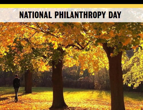 National Philanthropy Day banner featuring an autumn woodland scene.