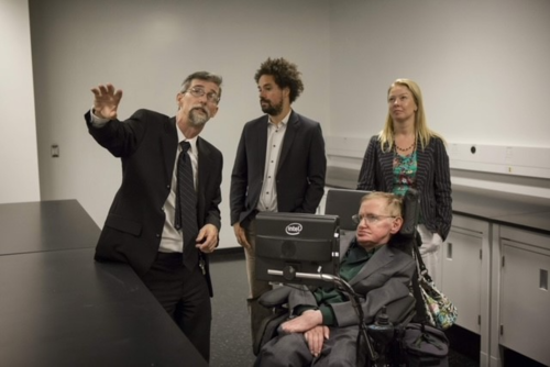 Scott Nicoll shows Dr. Stephen Hawking around the Quantum-Nano Centre at its 2012 grand opening.