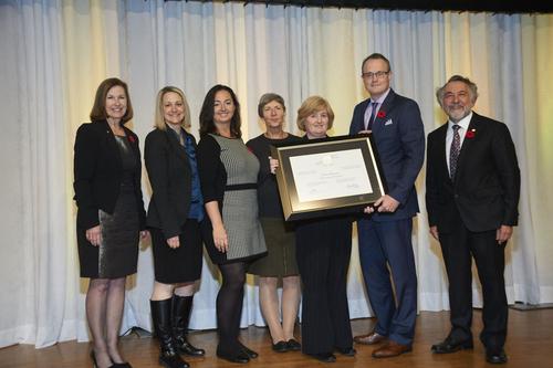 Representatives from Human Resources receive an Excellence Canada award.