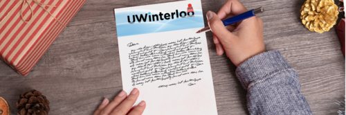 A person writes a penpal letter on uWinterloo letterhead.