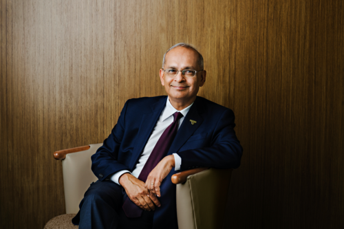 Dr. Vivek Goel seated in a chair.