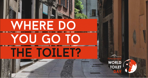 A city street with the words &quot;Where do you go to the toilet?&quot; laid over it.