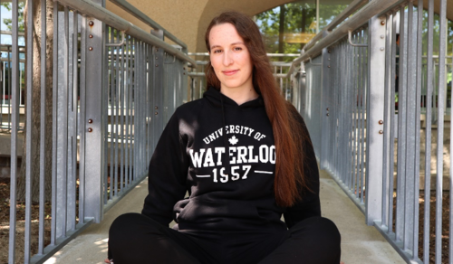 A model sports a University of Waterloo sweatshirt.