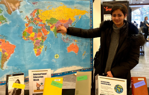 Waterloo student Amrit Kaur places a sticker on her home country India, at the Interactive Map display at the Dana Porter Library for IEW2019.