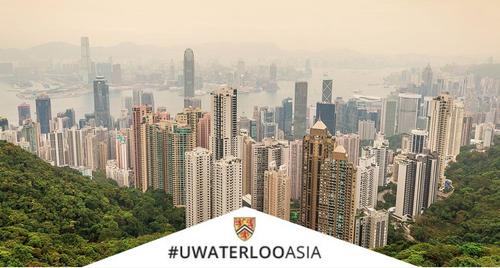 The Hong Kong skyline with #UWaterlooAsia logo.