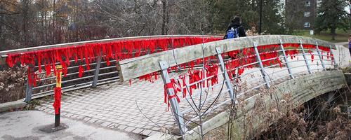 Strips of red cloth tied to the bridge between EV3 and St. Paul's.