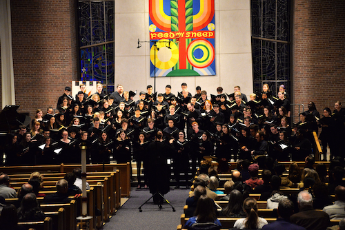 A choir performs in a church.