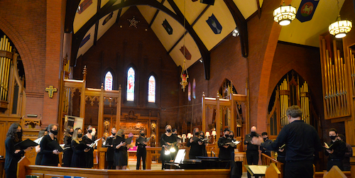 The Chamber Choir performs in a church.