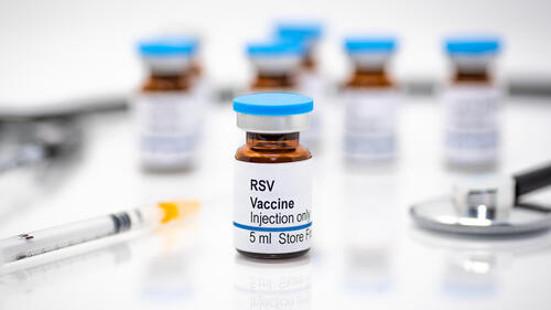 A close-up photo of RSV vaccines in bottles.