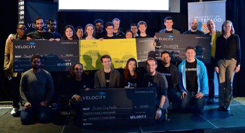 Velocity Fund winners pose with their oversized cheques.